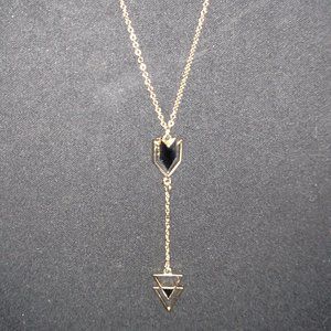 Artisan gold tone necklace with dangling black chevron & triangle pendant